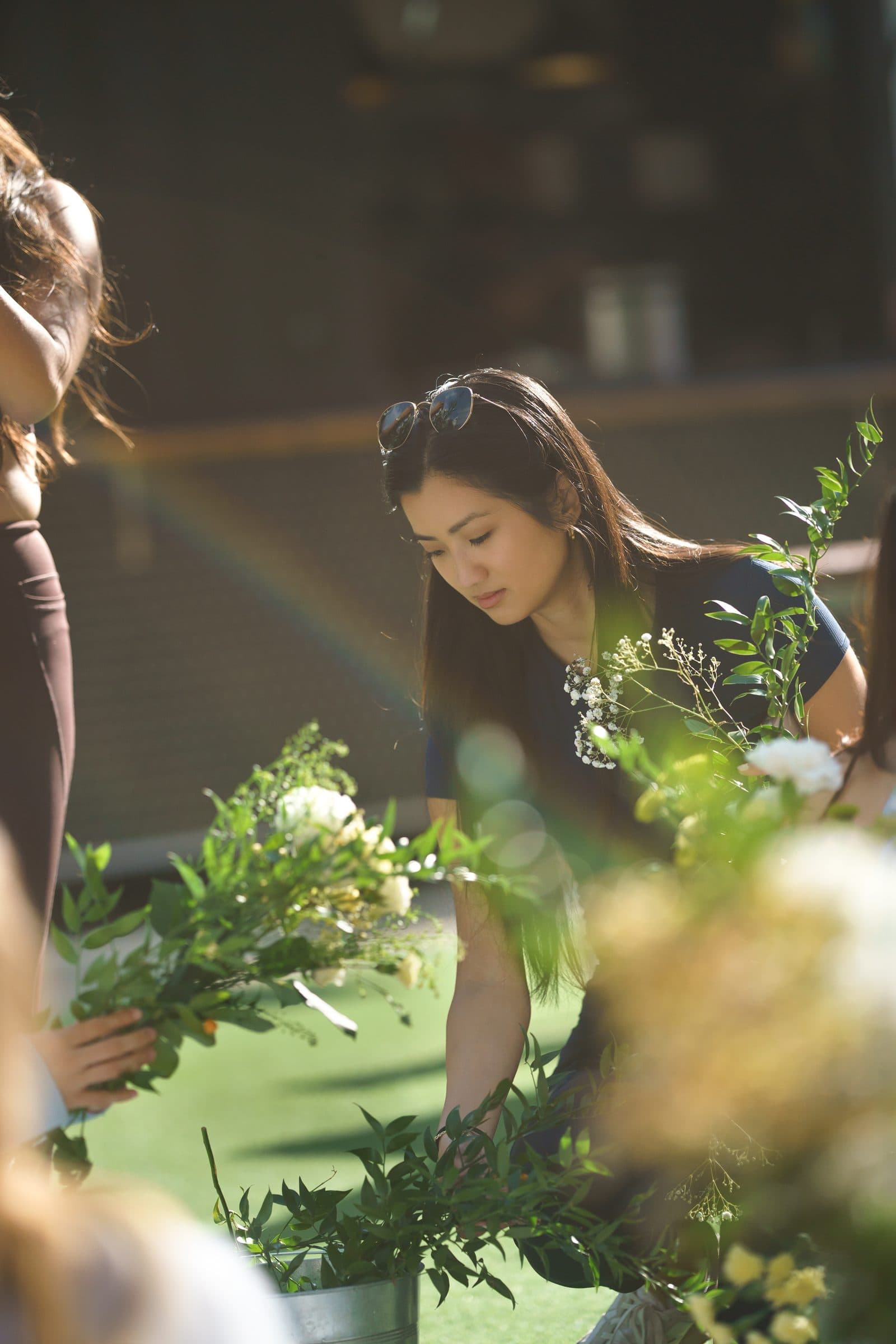 A guest picking flowers at the flower bar