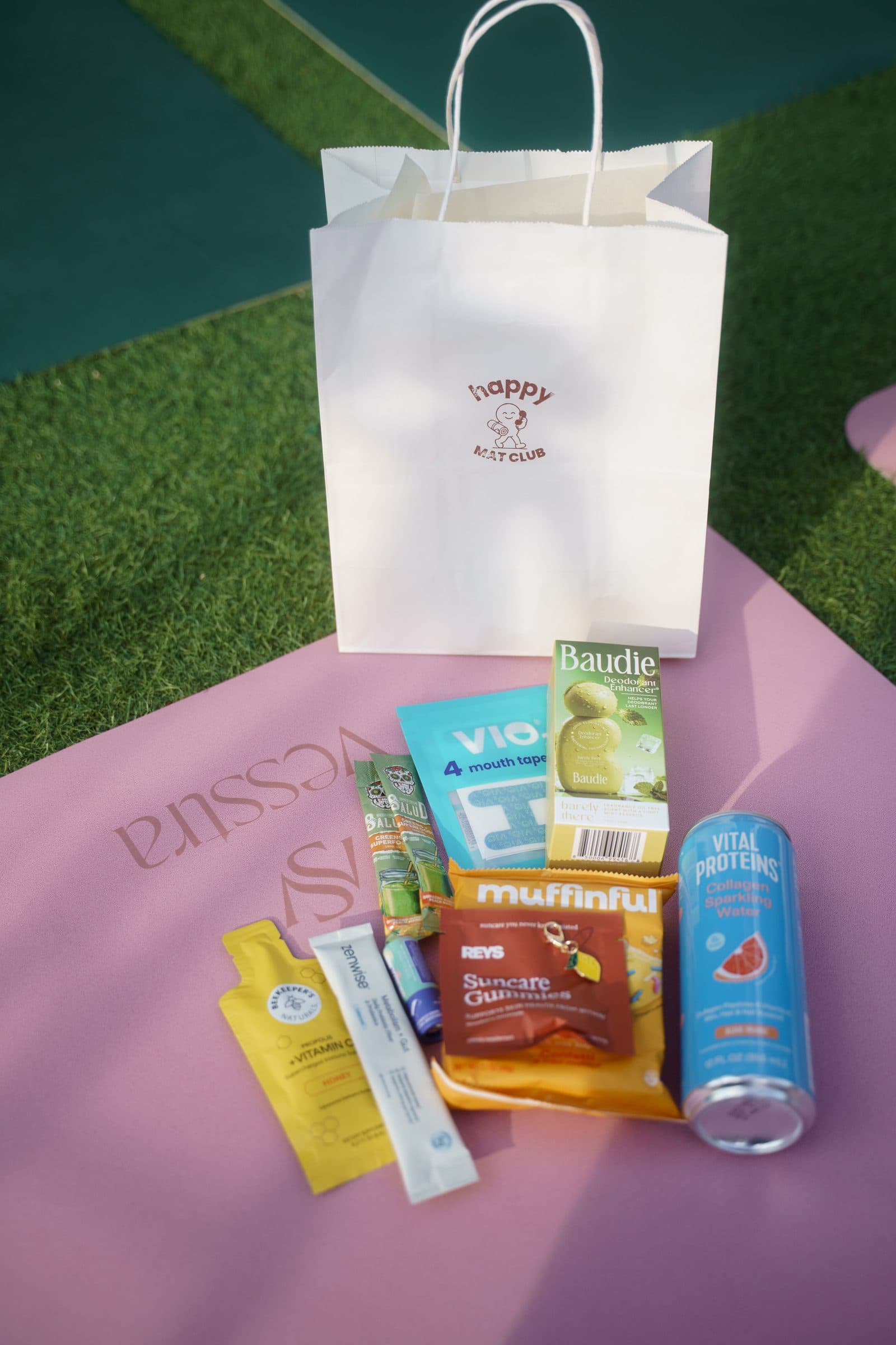 A Happy Mat Club bag with snacks on a mat