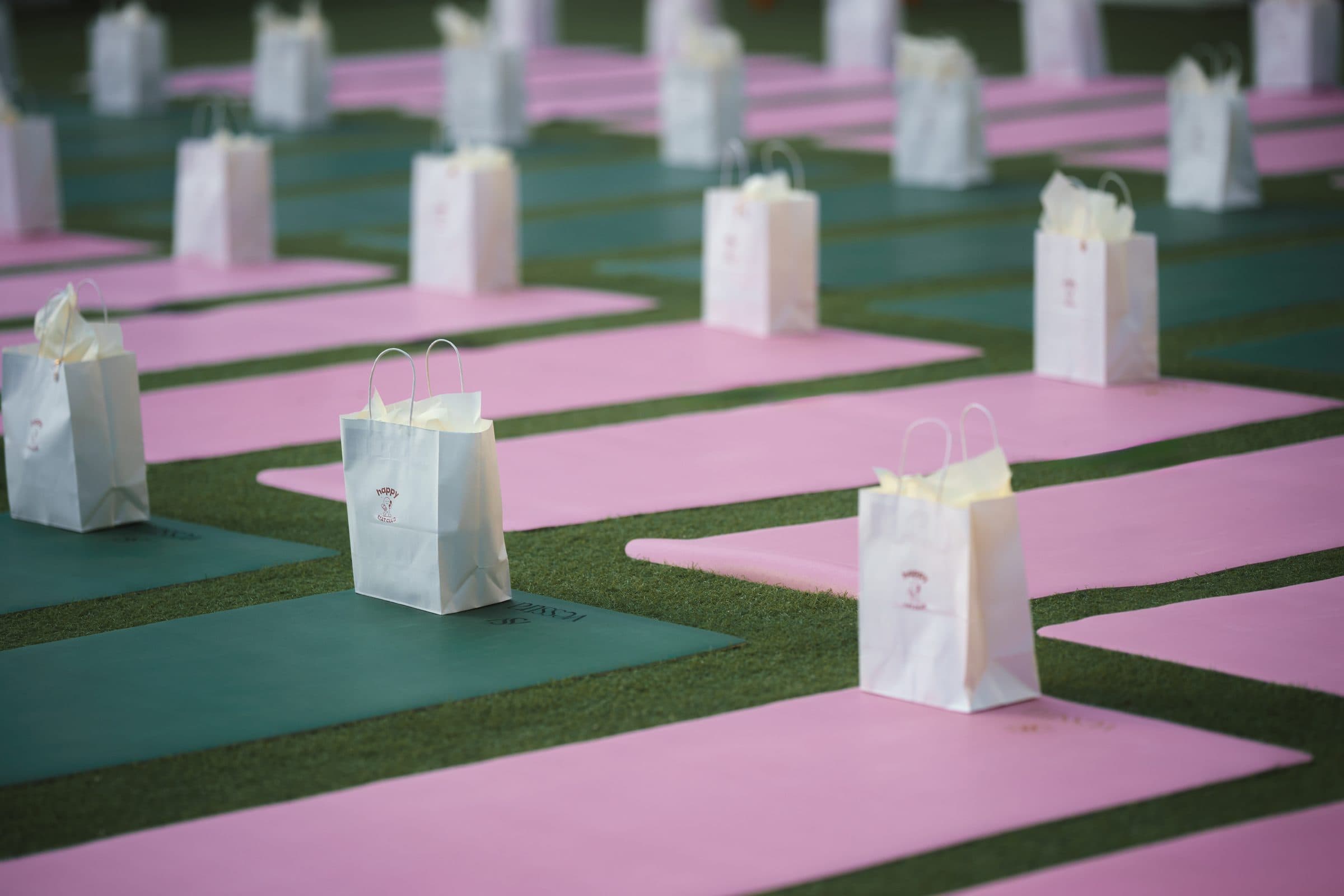 Mats and bags set up on the lawn before class